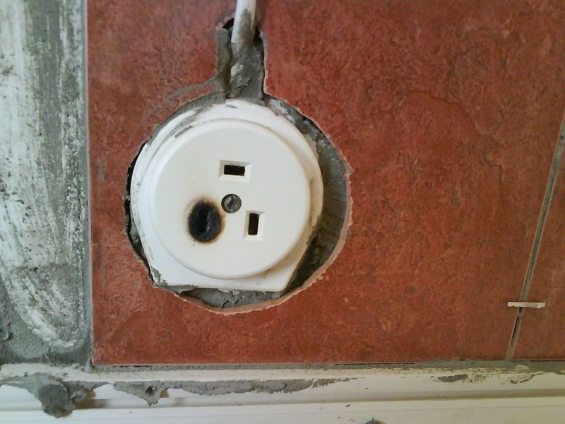 File:Burned stove socket.JPG