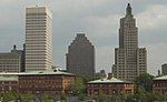 Three buildings, two of the same stature, and one smaller than the others.