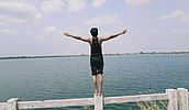 A youth villager enjoys the Kenud pond (Punasa Lift Irrigation Scheme BR-2 Kenud Pond)