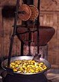 Silk cocoons boiling in water while fibres are extracted