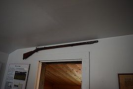 Pa's gun hangs over the door of the De Smet house.