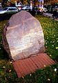 A rock with a commemorative plaque dedicated to the emblem of Rodło.