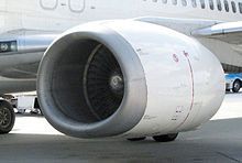 A close-up view of a CFM56-3 series engine mounted on a Boeing 737-400 showing flattening of the nacelle at the bottom of the inlet lip