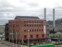 Photograph of a five-story, brick industrial building.