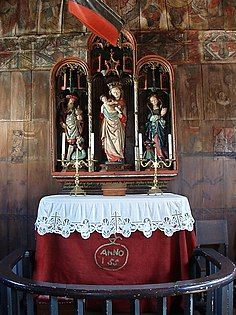 Altar with triptych and the hull of a votive ship