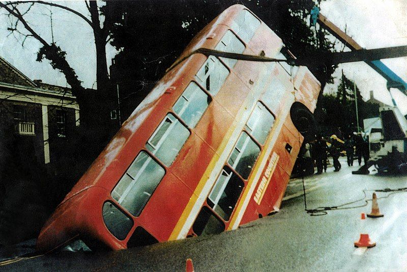 File:Bus in hole.jpg