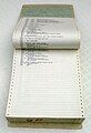 Listing of a large computer program on continuous form paper, bound in a printout binder.