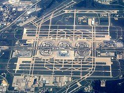 An aerial photograph of DFW Airport, including its runways.