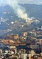 White smoke is seen from the television tower in the mountains of Lebanon from the deck of USS Iwo Jima (LHD 7), July 22.