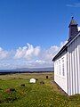 Strandarkirkja - exterior grounds with view of some graves