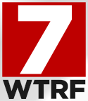 A white 7 in a red box. Beneath it and on a silver background are dark gray letters WTRF in a sans serif.