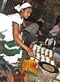 Image 3An Ethiopian woman preparing Ethiopian coffee at a traditional ceremony. She roasts, crushes, and brews the coffee on the spot. (from Culture of Africa)