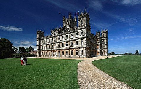 Highclere Castle in the far north of Hampshire, a large country house in the Jacobethan style by the architect Charles Barry, with a large park designed by Capability Brown, used as the set for Downton Abbey.