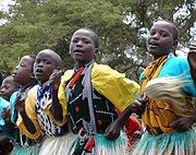 Kenyan boys and girls performing a traditional folklore dance.