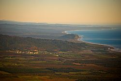 An aerial photograph of Ross, with the Tasman Sea seen to the right