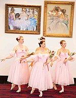 UNLV Ballet students dancing in front of Rita Asfour's ballet paintings