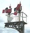 A semaphore signal fitted with a diamond sign denoting exemption from Rule 55