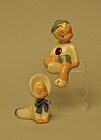 Jane Fauntz baby and sitting boy figurines.