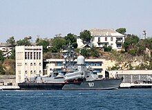 Grey military ship with missiles