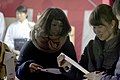 Young people in Osaka comparing omikuji on New Year's Eve