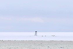 View of the remains of abandoned Izluchina Russian polar station at the northern end of Komsomolets Island