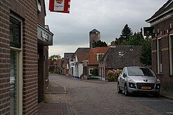 Village street with the water tower in the background