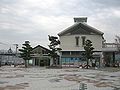 The JR station is the smaller building to the left. The larger building on the right which matches the Matsuura station design is used by another company.