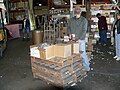 Stack pallets to create a higher work surface.