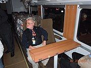 A pedestal table surface can be folded down in a passenger train