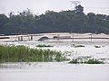 Land reclamation on the Buriganga river dredges sand and deposits it on the floodplain.