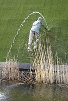 Tourism statue in Madurodam, Netherlands, of the nameless boy plugging a dike