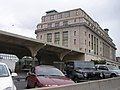 Trackside of the hotel/former station on June 23, 2011. The former canopy once housed two stub-end tracks and is now used for parking space. Parking in the foreground now occupies space where two through tracks stood along with part of the canopy that has since been demolished.