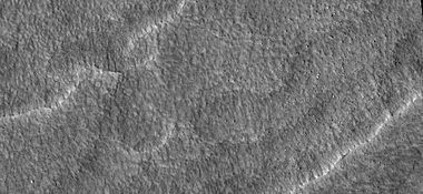 Close-up of scalloped ground, as seen by HiRISE under HiWish program. Surface is divided into polygons; these forms are common where ground freezes and thaws. Note: this is an enlargement of a previous image.