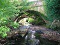 The 19th-century waggonway bridge (foreground) over the Lugton Water near Fergushill farm. The two bridges were known as the 'Elbo and chael.'[117]