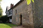 Odda's Chapel, Deerhurst, attached to later house.