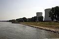 Biblis Nuclear Power Plant is on the Rhine river. On the right side two cooling towers from unit A. In the background a ship landing place where heavy components such as reactor vessels and steam generators were landed by ship.