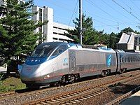 Silver and blue electric locomotive with a single cab