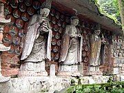 Southern Song Dynasty (1127–1279 CE) cliff carving of Vairocana (centre), with Manjushri (left), and Samantabhadra (right) among the Dazu Rock Carvings at Mount Baoding, Dazu District, Chongqing, China