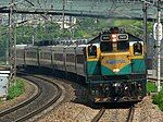 A Korail 7400 class diesel locomotive pulls a passenger train in South Korea in 2009