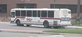 An OCTA bus at a stop on Main Street.