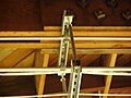 An overhead electrical wire hanger manufactured from two lengths of strut channel and two lengths of threaded rod.