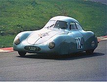 Blue sports racing car on the Nürburgring track in 1981.