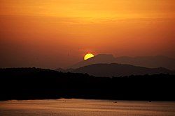 Sunset over Giritale Wewa and mountains