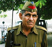 A constable of the Uttar Pradesh Police in India in forage cap