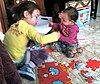 Girls assembling a puzzle.