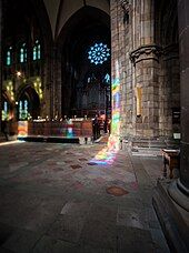 Reflection of Sir Eduardo Paolozzi's Millennium Window onto pillars in the Resurrection Chapel of the Cathedral