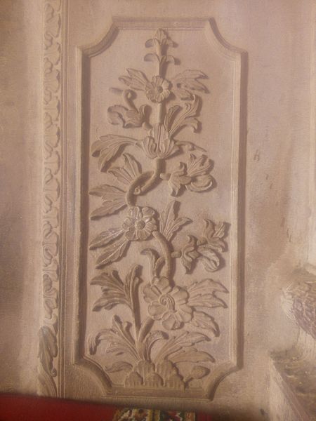 File:Carvings on wall.jpg