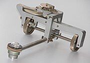 A linear planimeter. Wheels permit measurement of long areas without restriction.