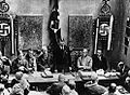 Image 10Adolf Hitler (standing) delivers a speech in February 1925. (from 1920s)