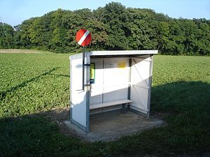 White shelter with a stop sign